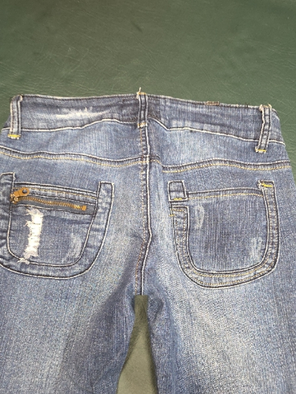 **Women’s Skinny Distressed Blue Jeans with Burgundy Patch Details** - Picture 7 of 11